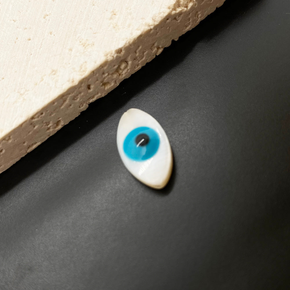 Evil eye shell charm